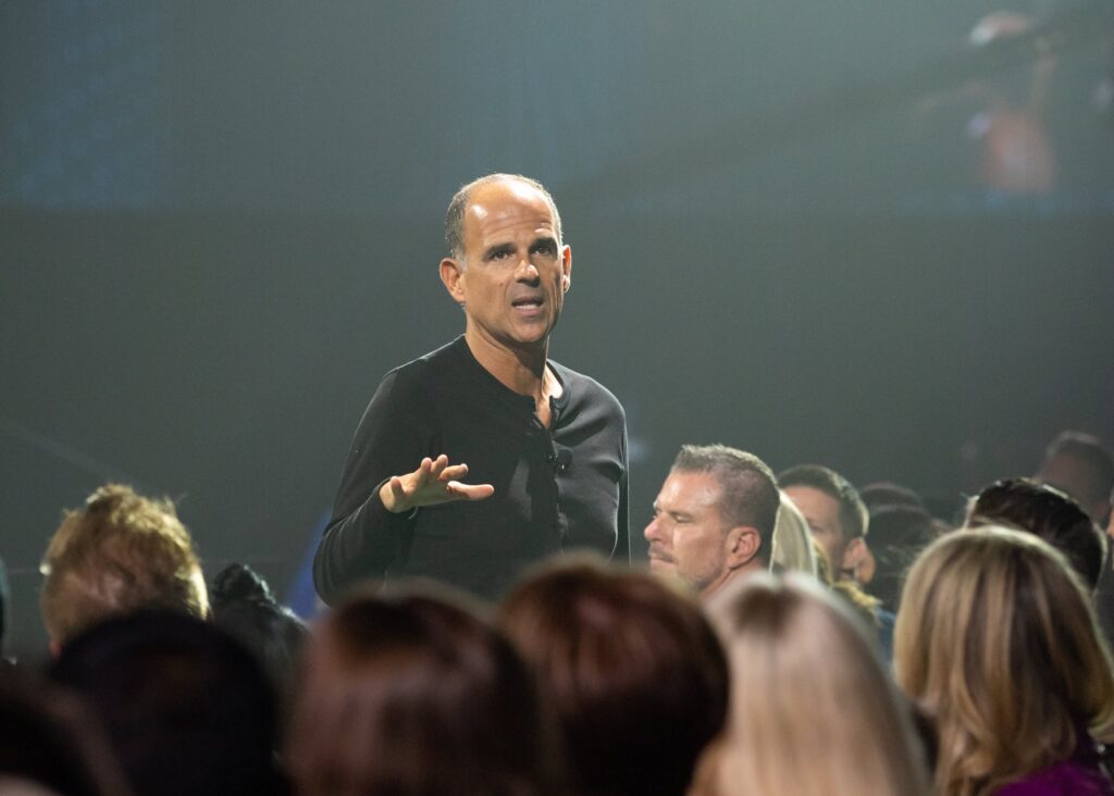 Marcus Lemonis speaking to auditorium